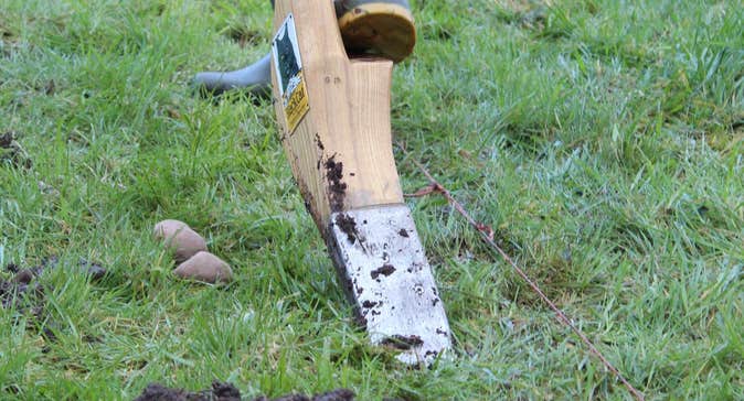 Demonstration of the old tradition of turning the sod with the Loy from Loy Association of Ireland, on Potato day.