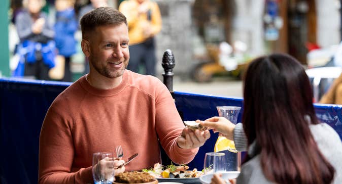 A couple eating food in Galway city