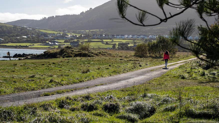 A person walking the Killaspugbrone Loop in County Sligo.