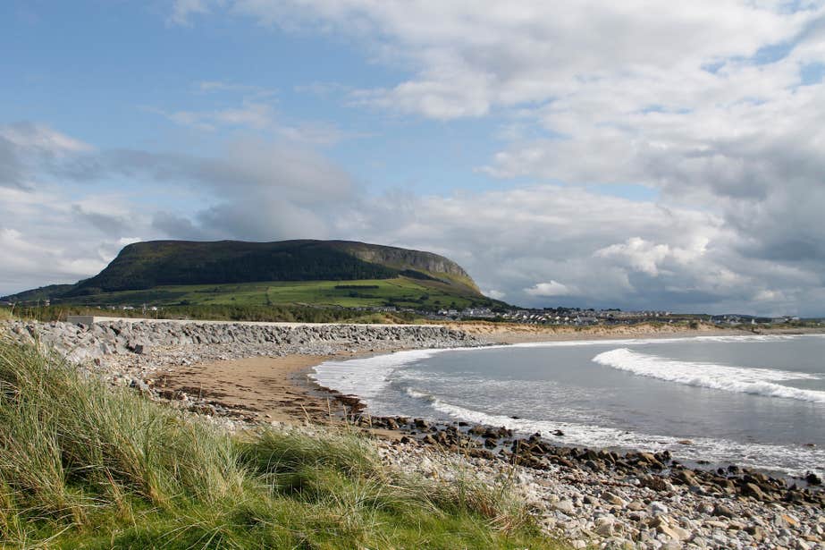 A beach with Knocknarea Mountain in the background in County Sligo.