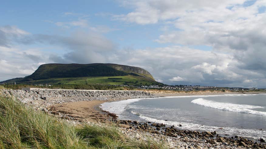 A beach with Knocknarea Mountain in the background in County Sligo.
