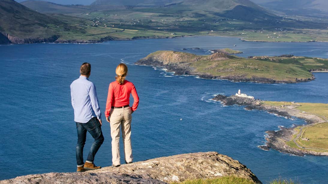 A couple looking out from the top of Geokaun Mountain, Valentia Island, Co. Kerry