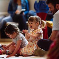 Image © Pimlico Project, 2 young girls are seated on a floor drawing