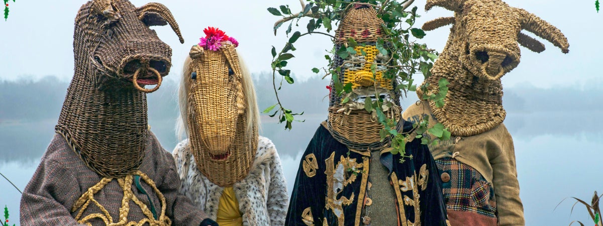 Armagh Christmas Rhymers at Dublinia - 4 people in rural costumes with heads covered by large wicker heads of animals