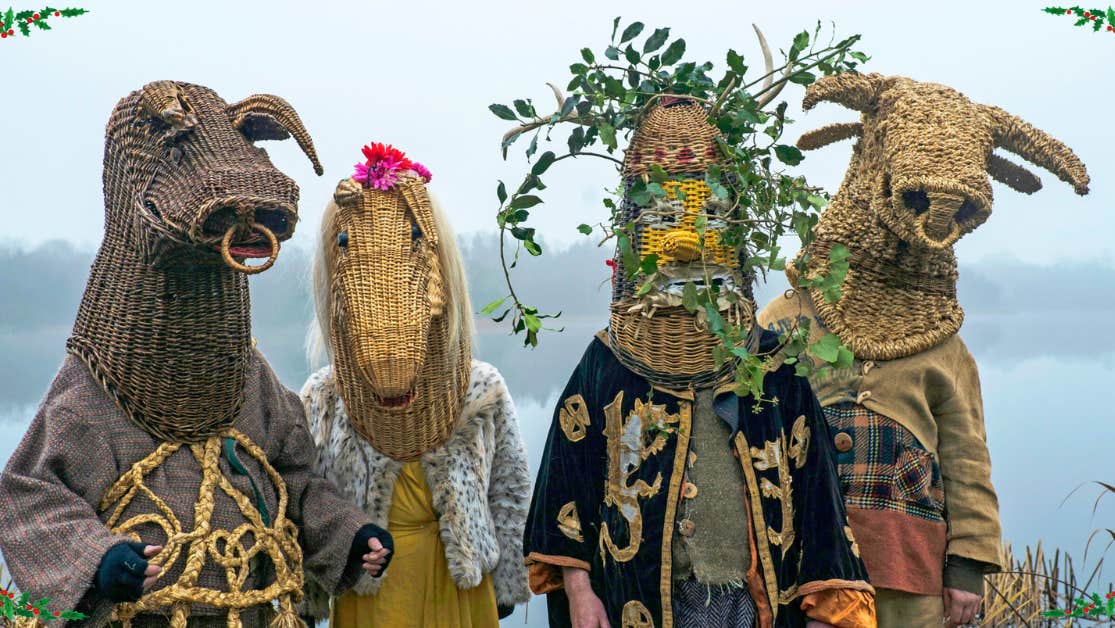 Armagh Christmas Rhymers at Dublinia - 4 people in rural costumes with heads covered by large wicker heads of animals