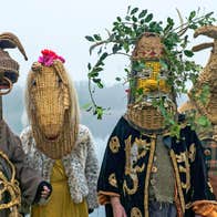 Armagh Christmas Rhymers at Dublinia - 4 people in rural costumes with heads covered by large wicker heads of animals