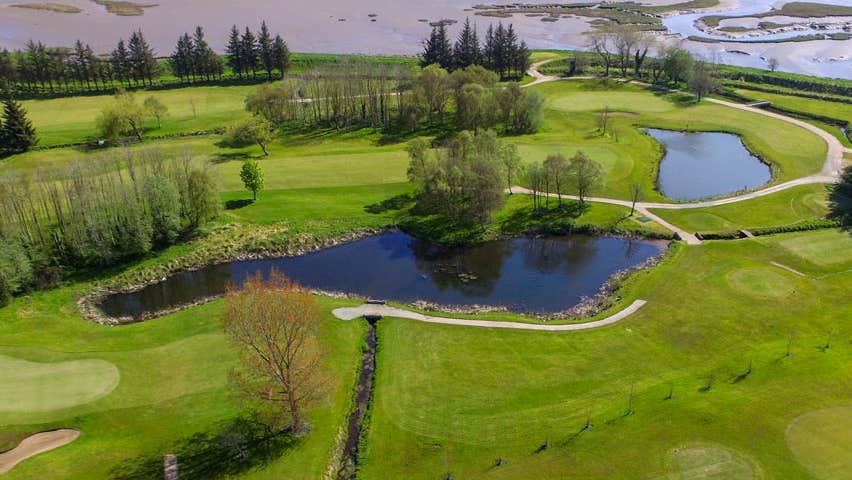 Letterkenny Golf Club aerial view of a green showing water features and Lough Swilly in the background