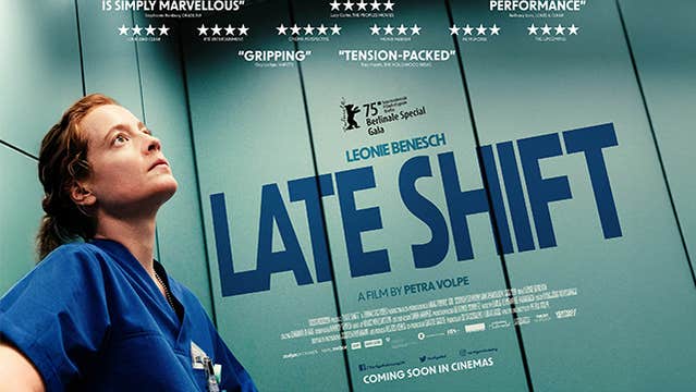 Film poster with a person in dark blue medics uniform in a lift looking thoughtful