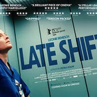 Film poster with a person in dark blue medics uniform in a lift looking thoughtful