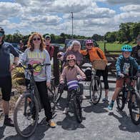 A family group about to set off and on a cycle tour