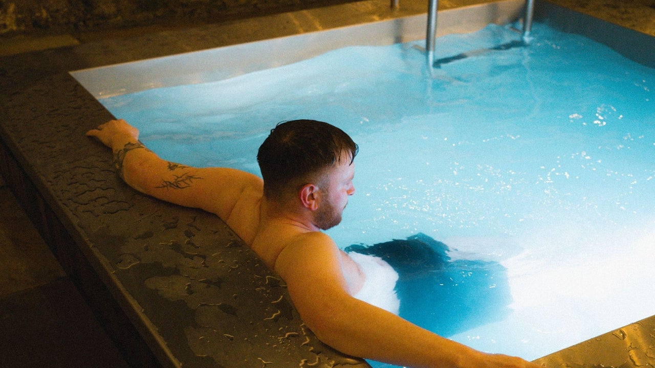 A person relaxing in a heated plunge pool at Helios Sauna Dundrum