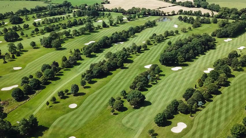 An aerial view of the course showing the greens and fairways