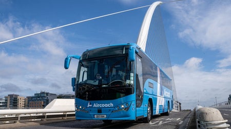 An Aircoach bus on the road