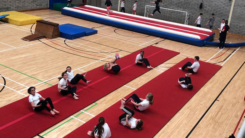 People exercising in a sports hall