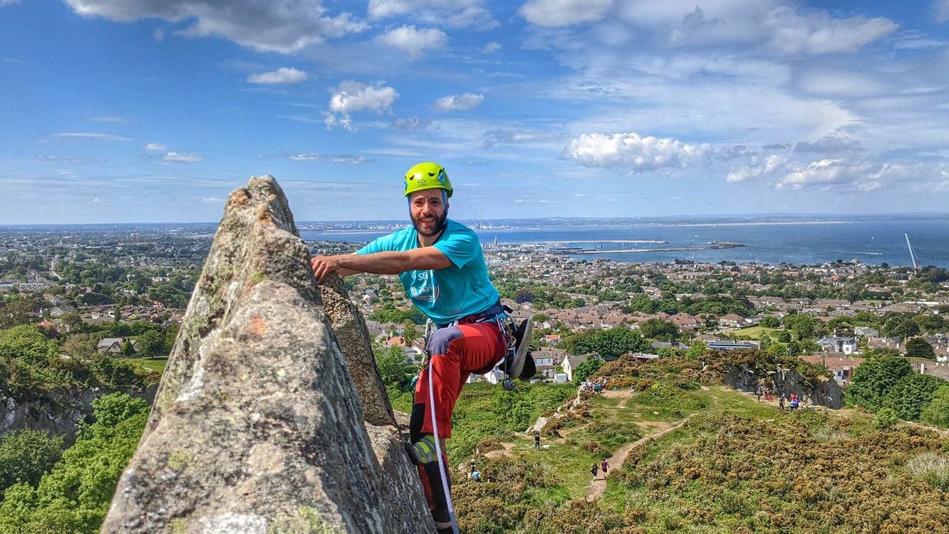 A person rock climbing outside Dublin with HikeandClimb