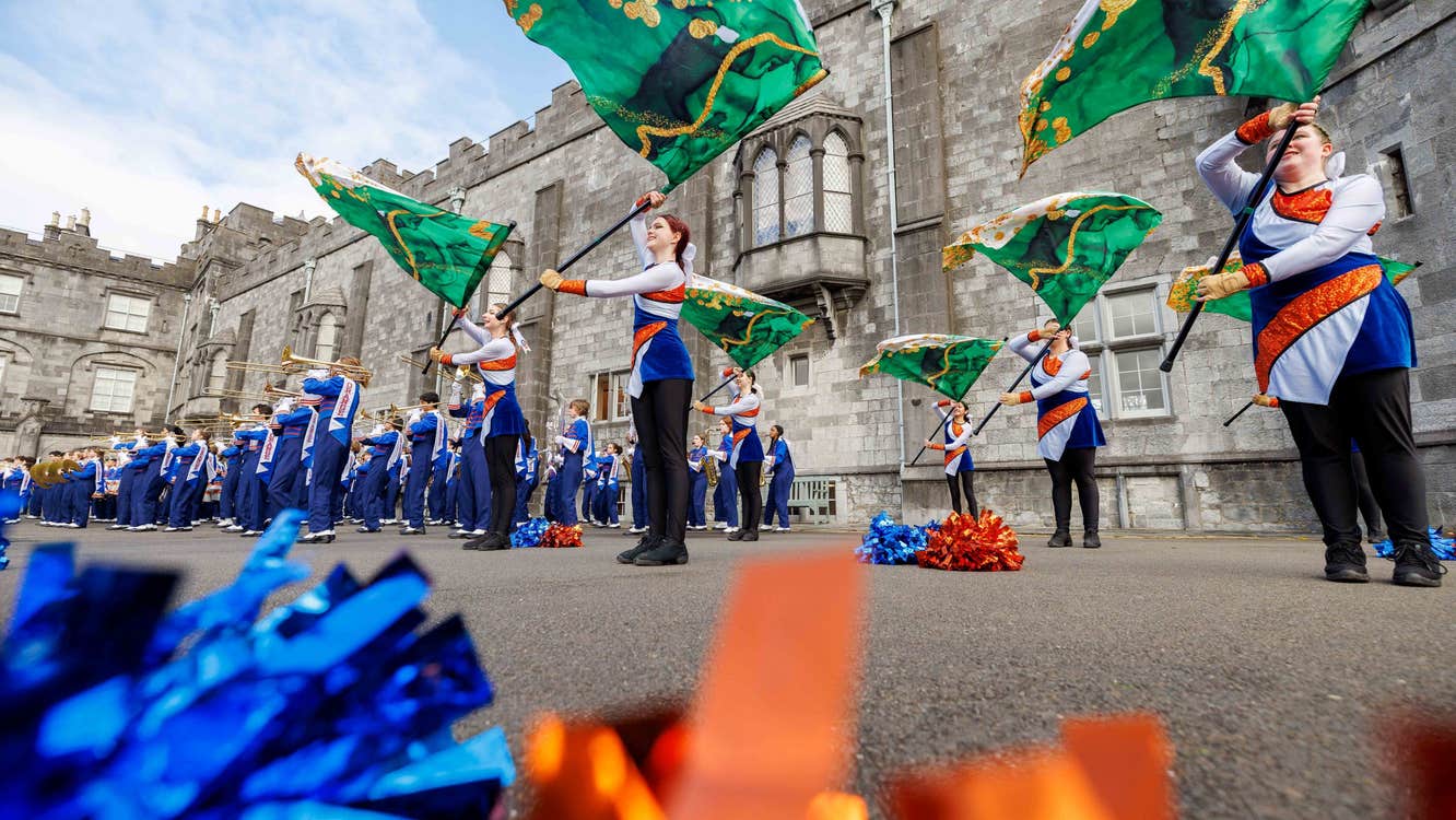 American Marching Band throw flags as part of a performance outside Kilkenny Castle.