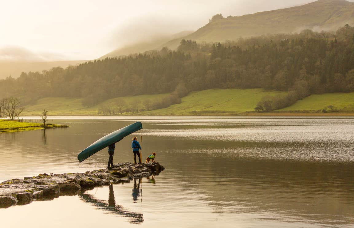 Image of a couple with their dog on Glencar Lake in County Leitrim