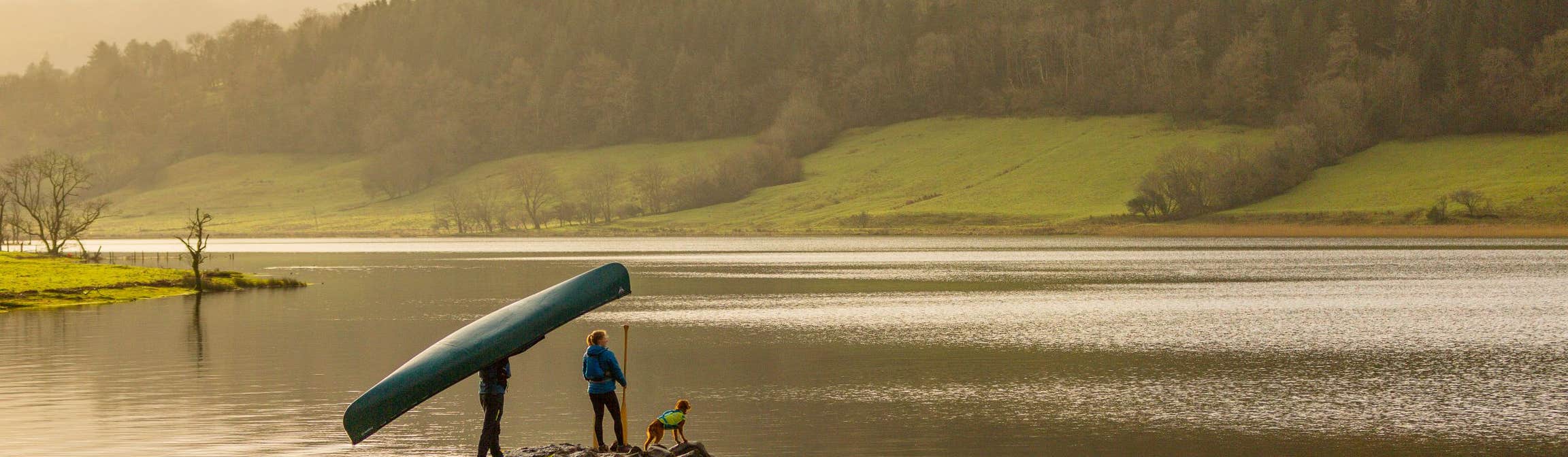 Image of a couple with their dog on Glencar Lake in County Leitrim