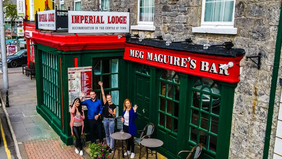 Front view of property with people outside