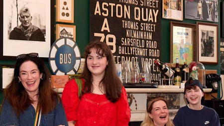 Visitors engaging with exhibits in a memorabilia filled gallery