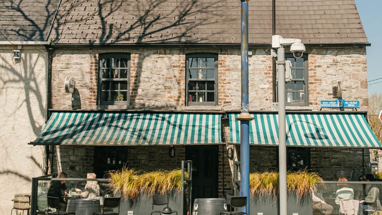 View of the ELY Wine Store and outside seating area from the street