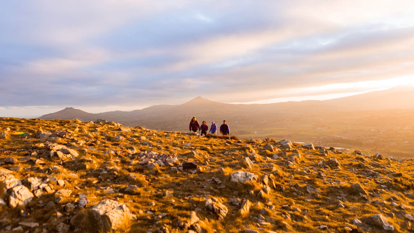 Walkers at sunset, Hilltoptreks, Dublin