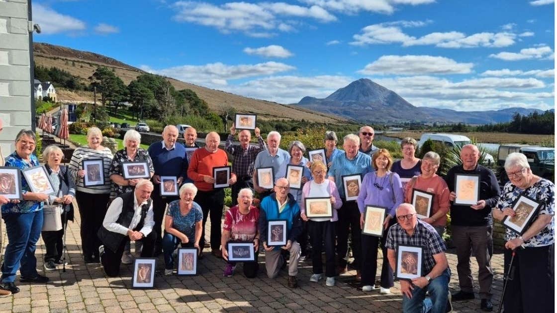 Large group of people on a sunny day holding their craft works