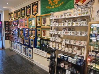 Shop interior with shelves full of heraldic items for sale