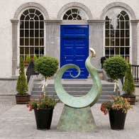 A sculpture outside a bright blue door at King House Georgian Mansion in County Roscommon.