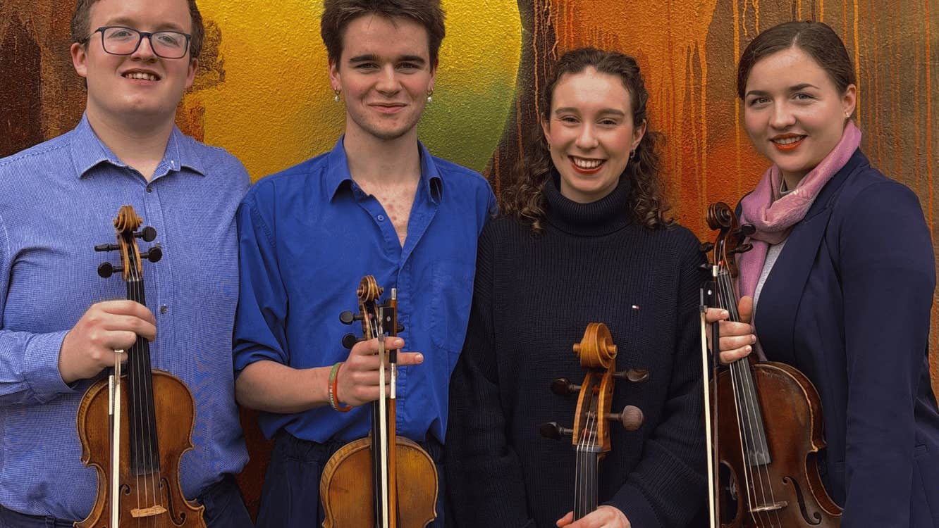 The members of the Meliora Quartet with their instruments.