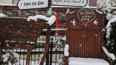 A view of Taylors Three Rock love chair and traditional sign posts