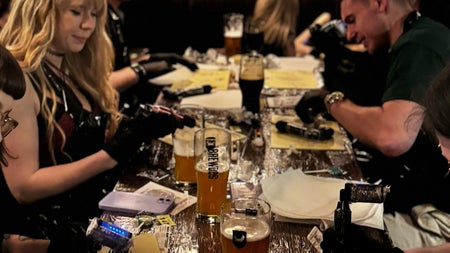 A table full of guests bent over their practice skins, tattoo machines buzzing as they concentrate on their designs. Drinks pushed aside, all focus on the art at Dublin’s most creative night out.