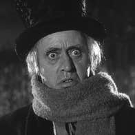 A frightened man in a top hat and scarf.