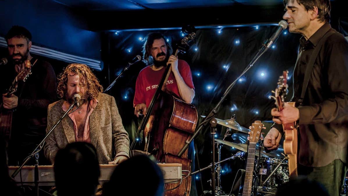 NCH Landmarks: Hothouse Flowers, a group of men playing instruments on a small stage.