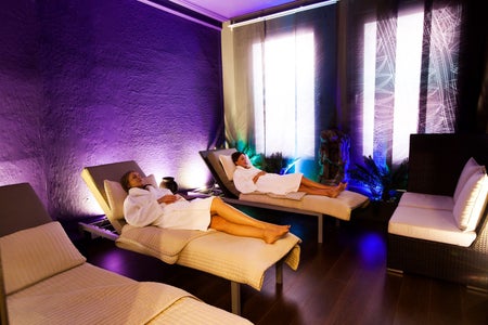 Two robed ladies relax in the Tranquillity Room at Buff Day Spa