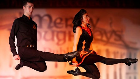 Two Irish dances appear to be suspended in mid air during a dance