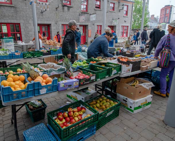 Merchants serving shoppers at the Carrick-on-Shannon Farmer's Market in County Leitrim.
