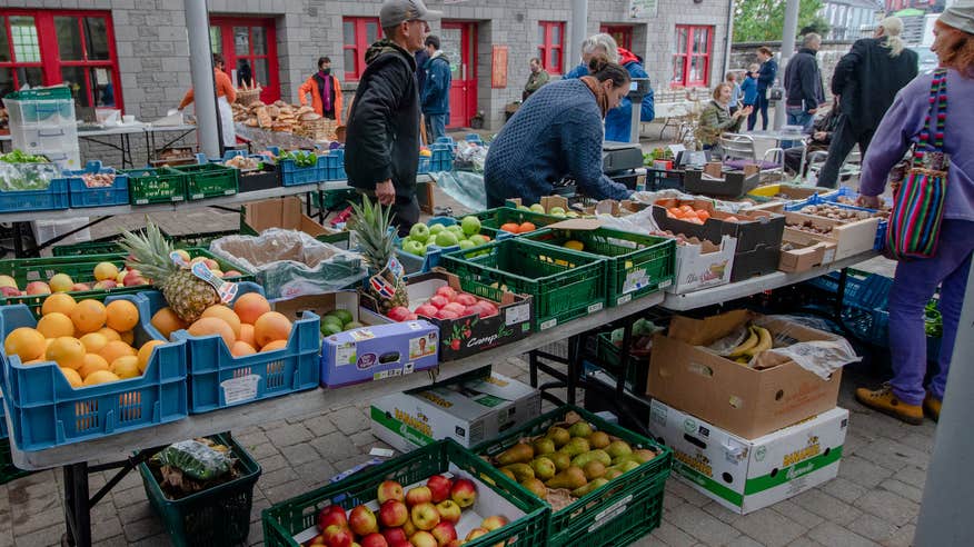 Merchants serving shoppers at the Carrick-on-Shannon Farmer's Market in County Leitrim.