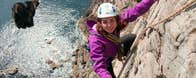 Girl climbing rockface at Donegal Climbing Muff Malin Head County Donegal 