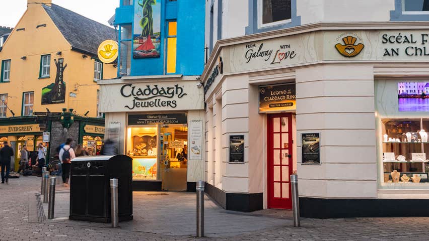 A street view of Claddagh Jewellers with people walking along the street