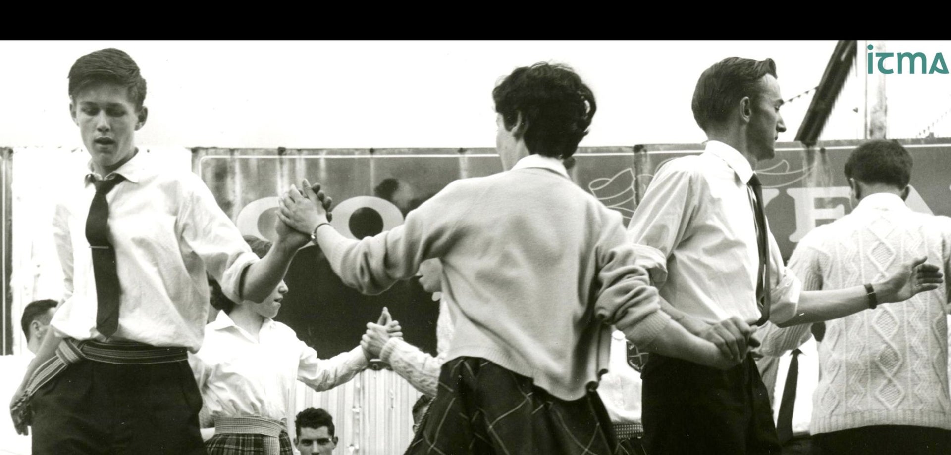 1950s black and white image of several couples dancing