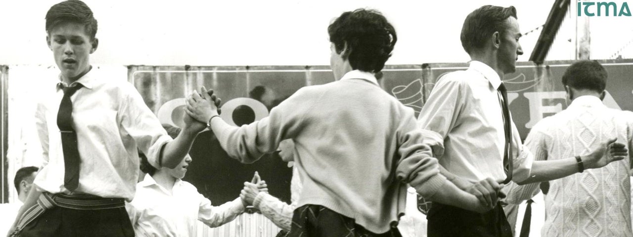 1950s black and white image of several couples dancing