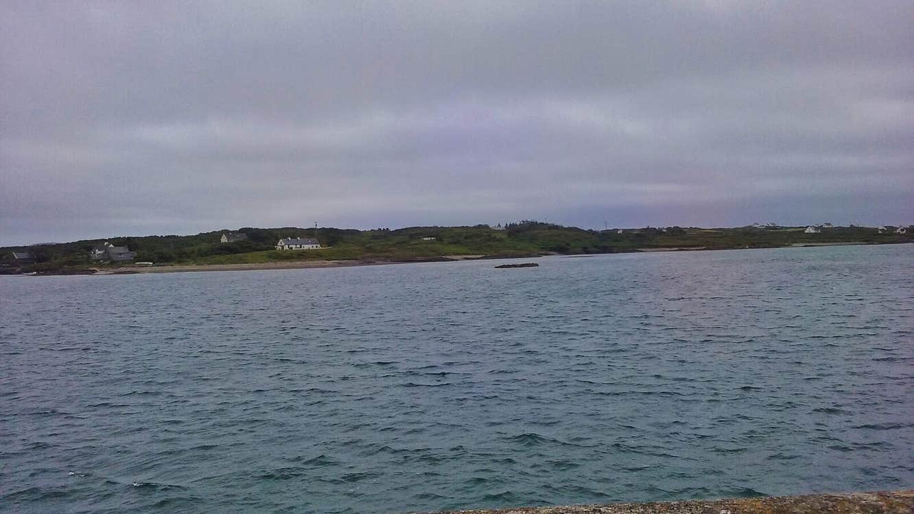 View from wall towards an island with a house in the distance