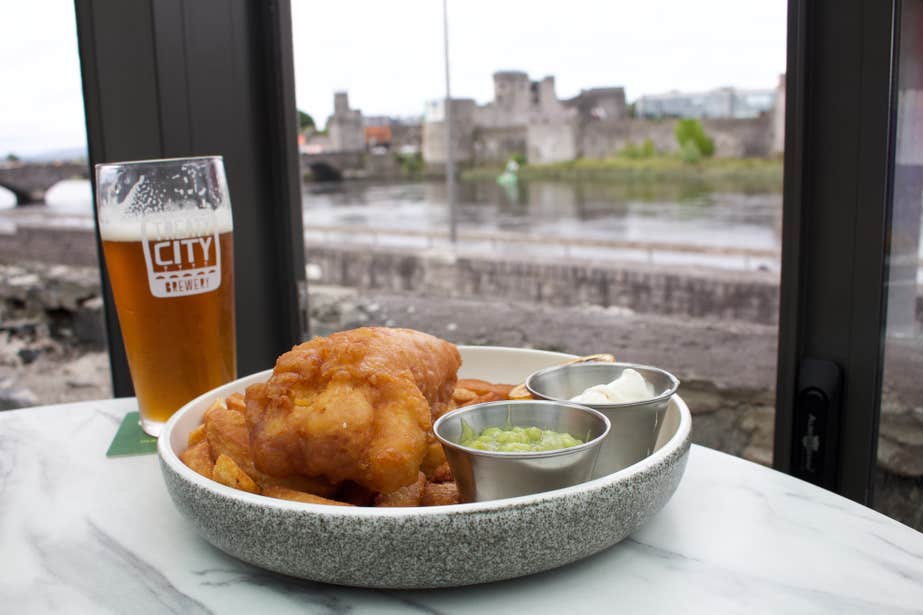 Fish and chips from Curragower Bar and Restaurant in Limerick city, served with a pint of beer.