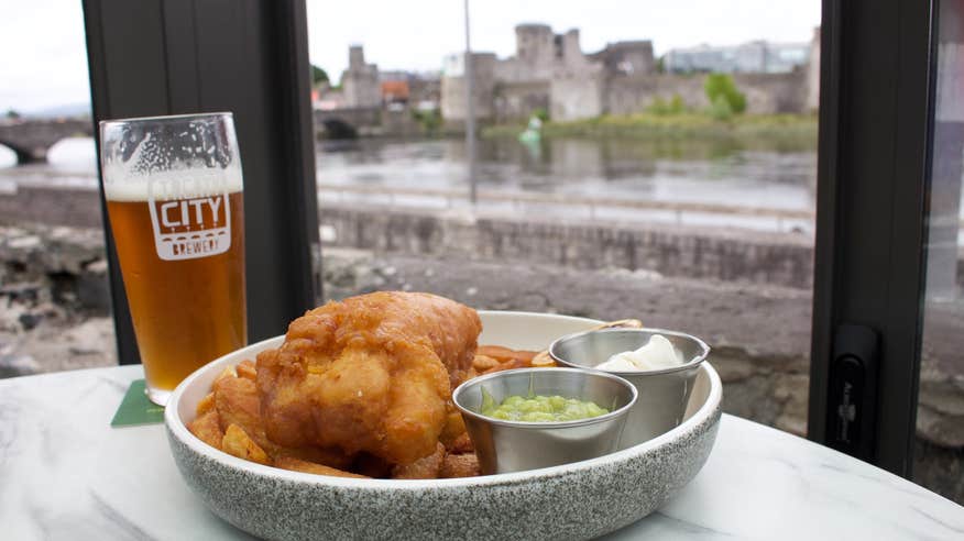 Fish and chips from Curragower Bar and Restaurant in Limerick city, served with a pint of beer.