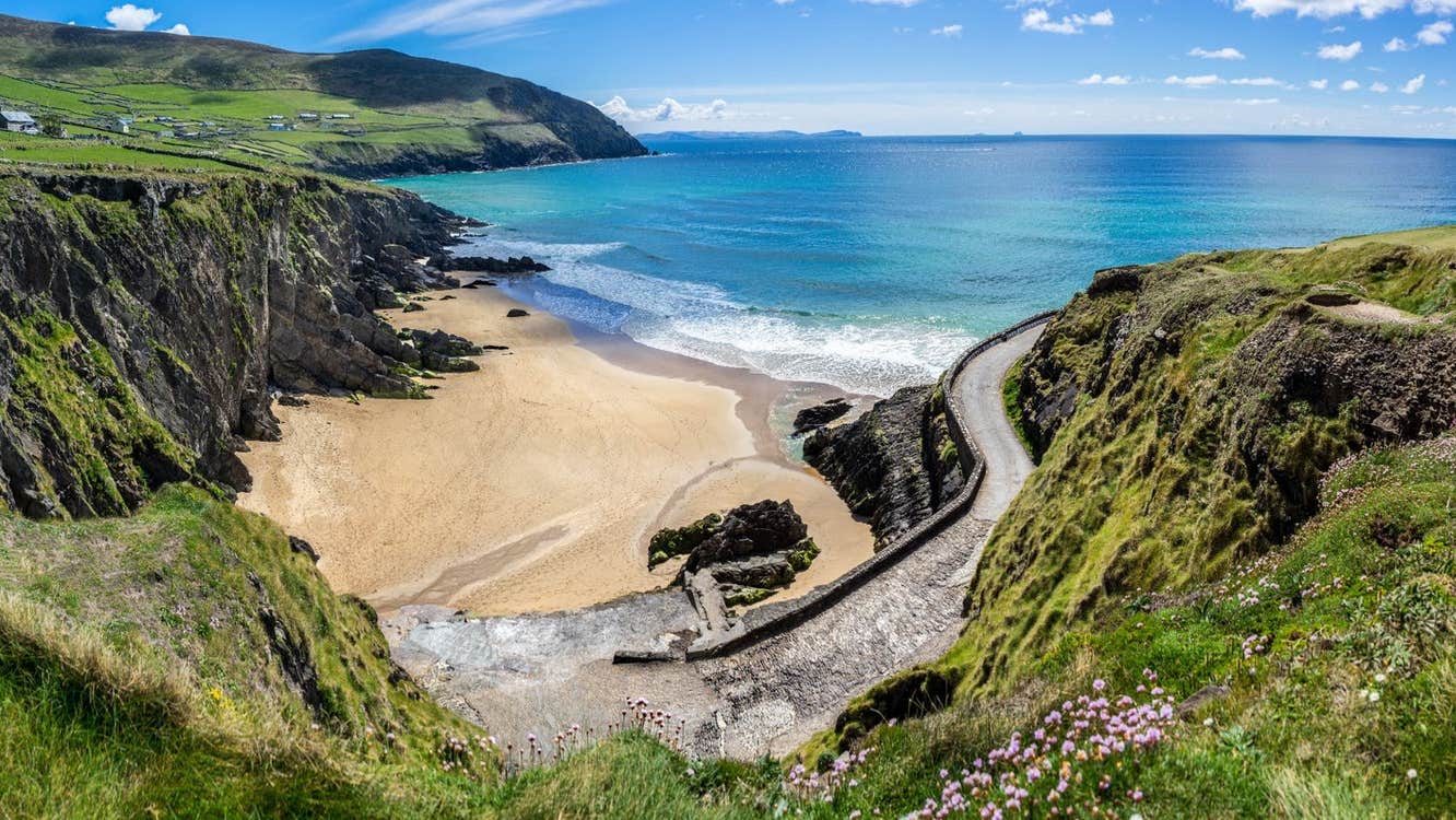 A winding lane leading down to a beach