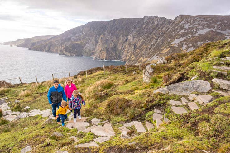 A family hiking up Sliabh Liag (Slieve League) in County Donegal