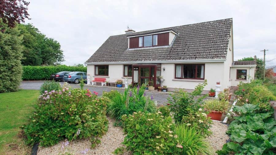 Exterior of house set in mature garden