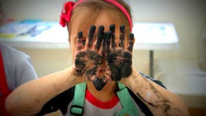 Image of kid with painted hands