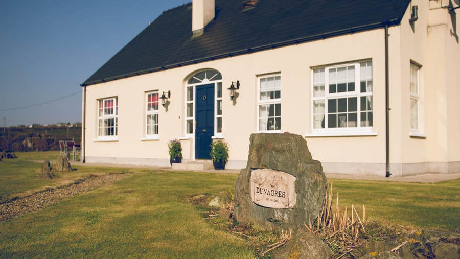 Cream house with blue door
